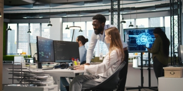 Startup office manager congratulates young girl after developing AI models