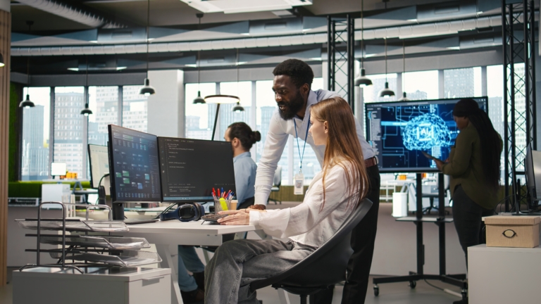 Startup office manager congratulates young girl after developing AI models