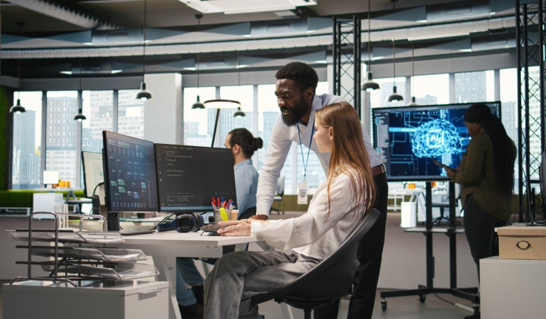 Startup office manager congratulates young girl after developing AI models